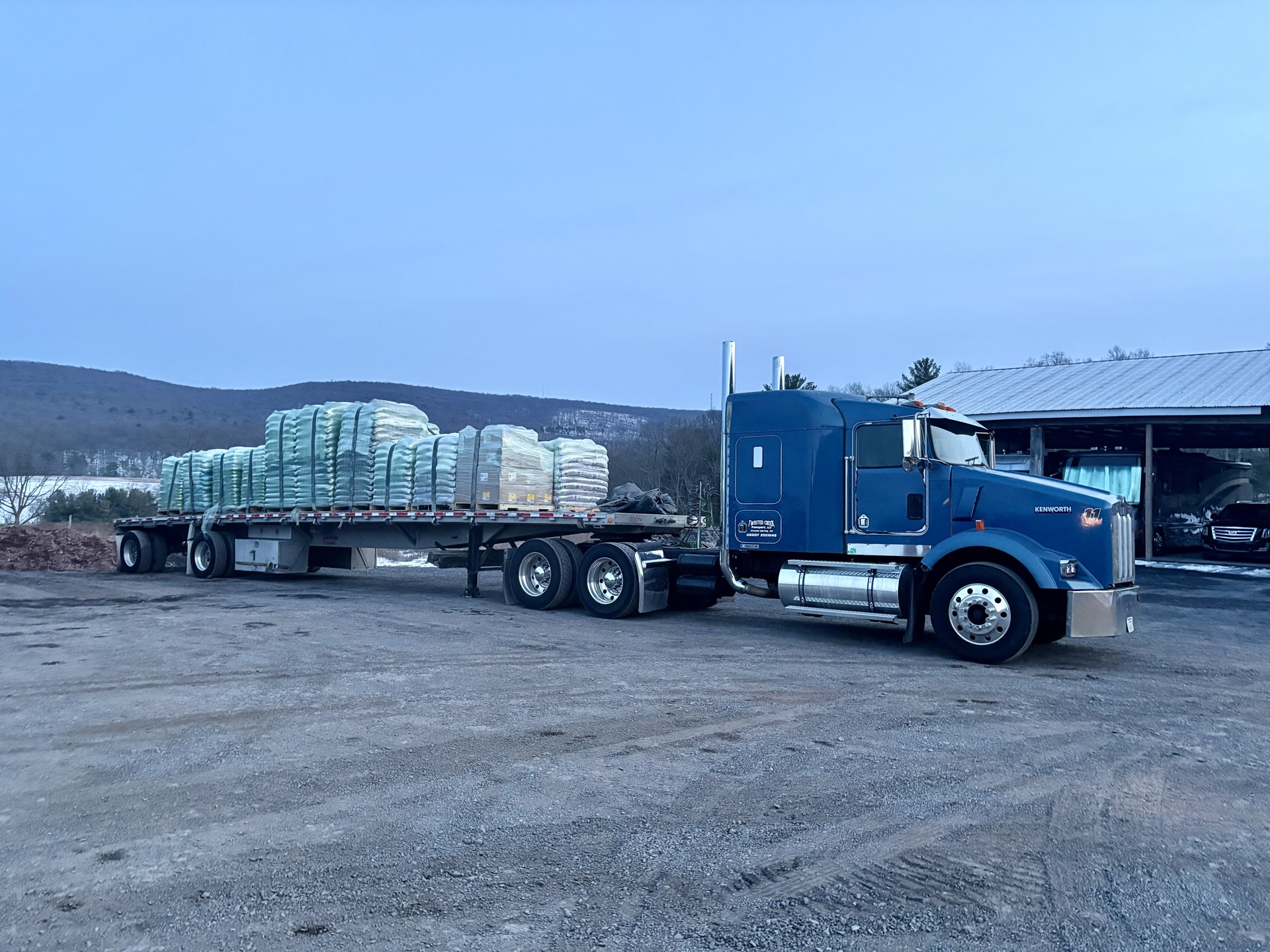 Kenworth W900 with palletized flatbed load