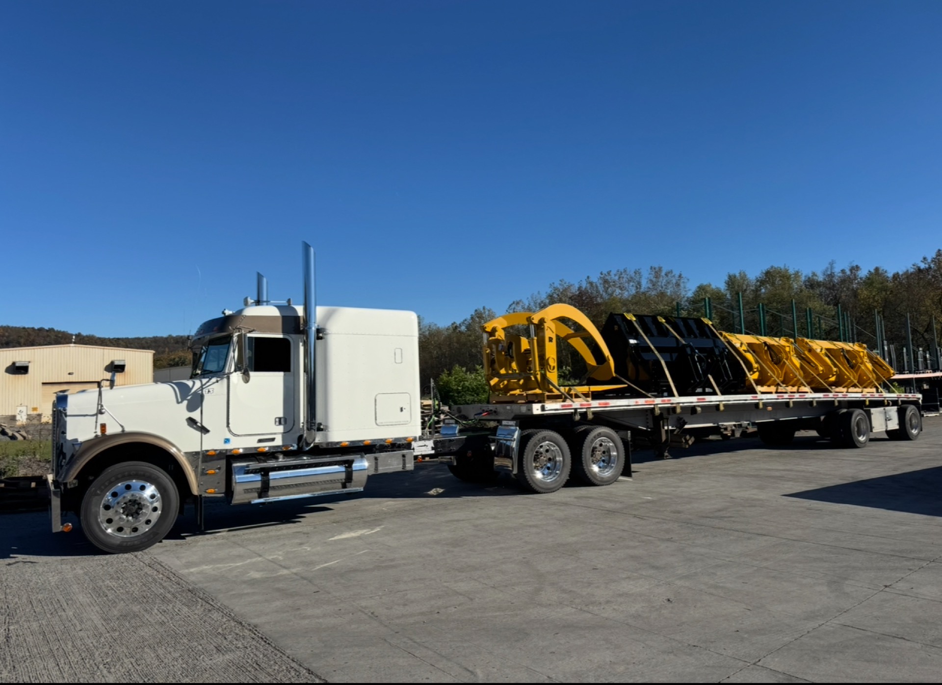 Freightliner with industrial machinery on flatbed