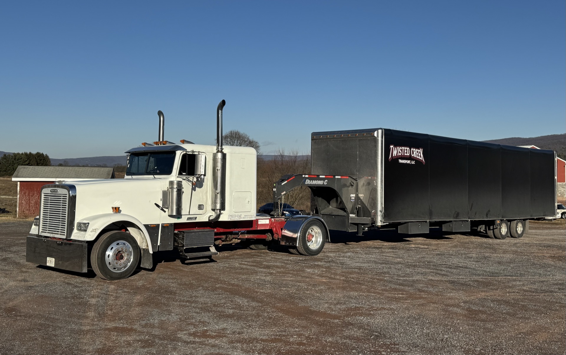 Twisted Creek Transport Freightliner with branded enclosed trailer